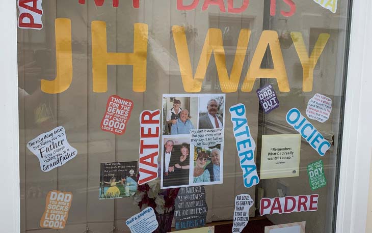 A window display with various way to say dad in different languages.